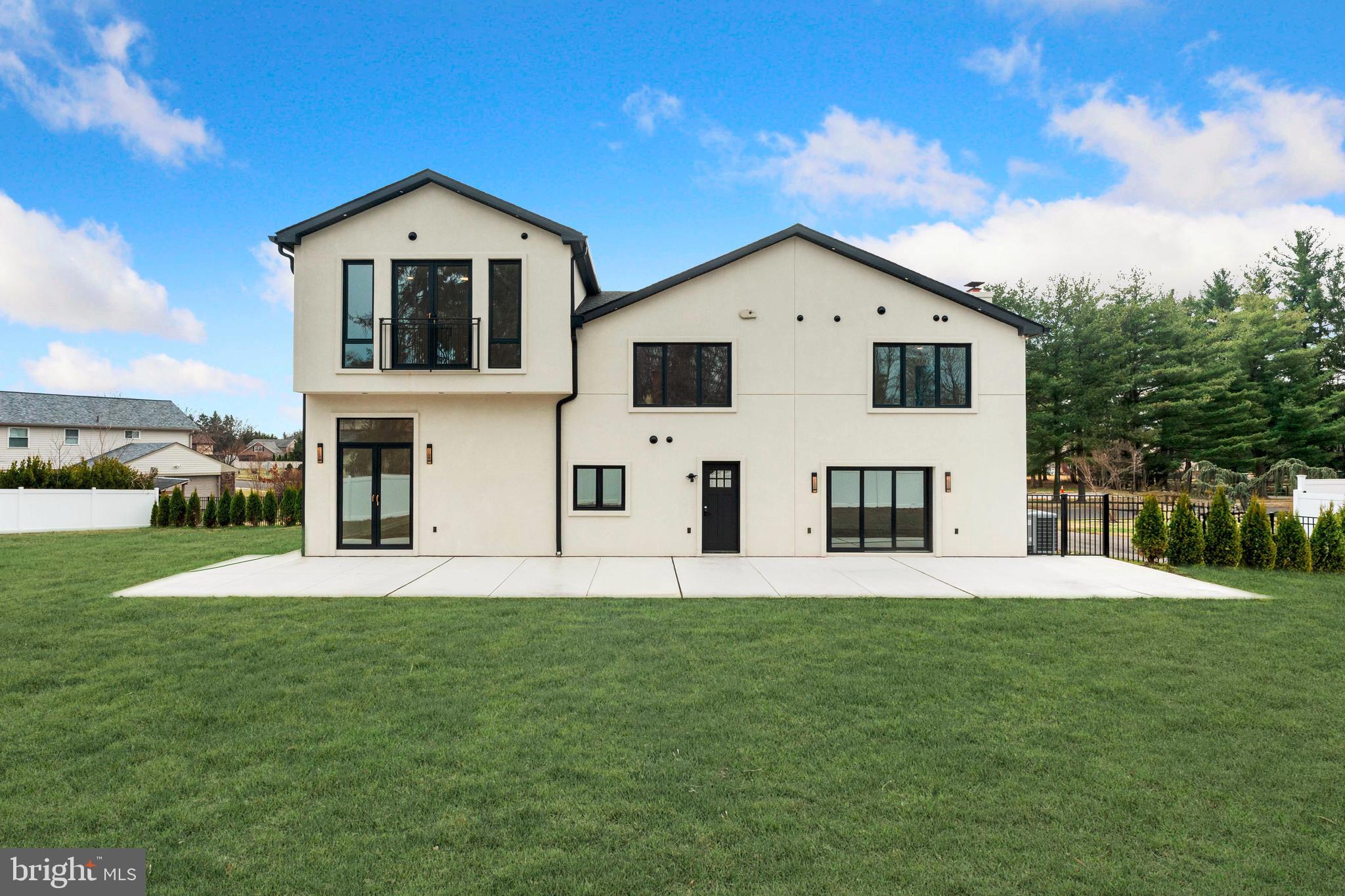 3750 Wheatsheaf Road Huntingdon Valley, PA 19006 - Photo 41 of 45 a front view of a house with a yard and garage