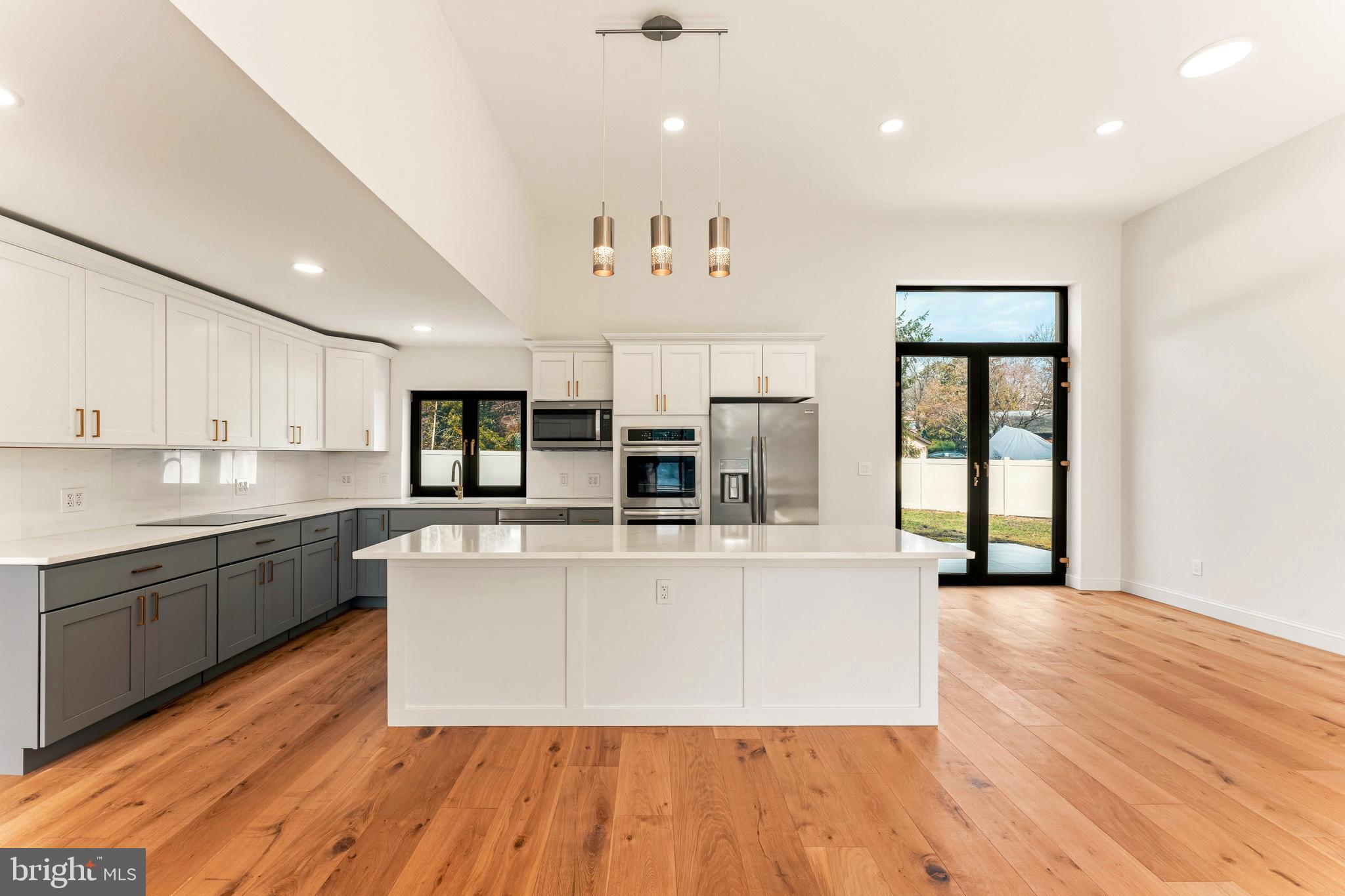 3750 Wheatsheaf Road Huntingdon Valley, PA 19006 - Photo 10 of 45 a large kitchen with stainless steel appliances granite countertop a stove a sink and a microwave