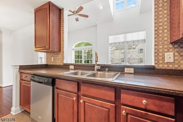 a kitchen with a sink and a window