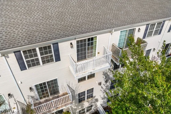 an aerial view of a house with yard and outdoor seating