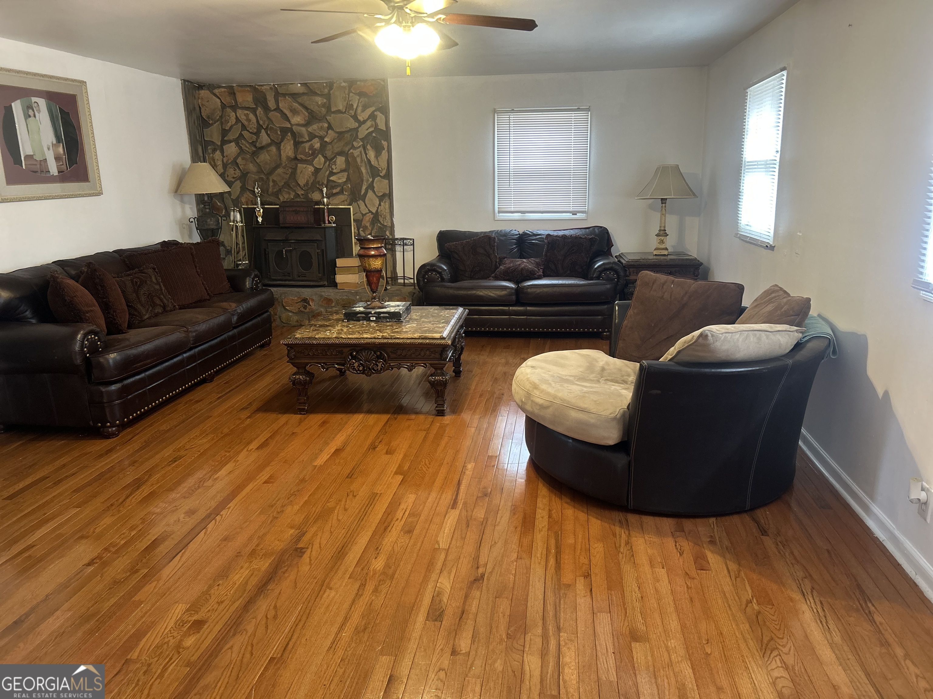 1406 Canterbury Road Griffin, GA 30223 - Photo 13 of 26 a living room with furniture and a fireplace