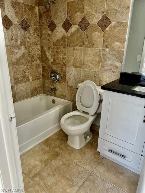 142 Santa Clara Drive, Unit 7 Naples, FL 34104 - Photo 16 of 41 Full bath featuring toilet, tub / shower combination, vanity, and tile patterned flooring