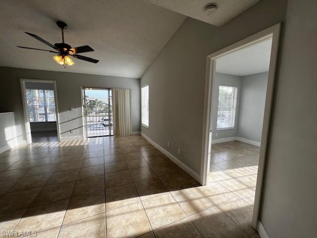 142 Santa Clara Drive, Unit 7 Naples, FL 34104 - Photo 3 of 41 Tiled empty room with a textured ceiling, a ceiling fan, and baseboards