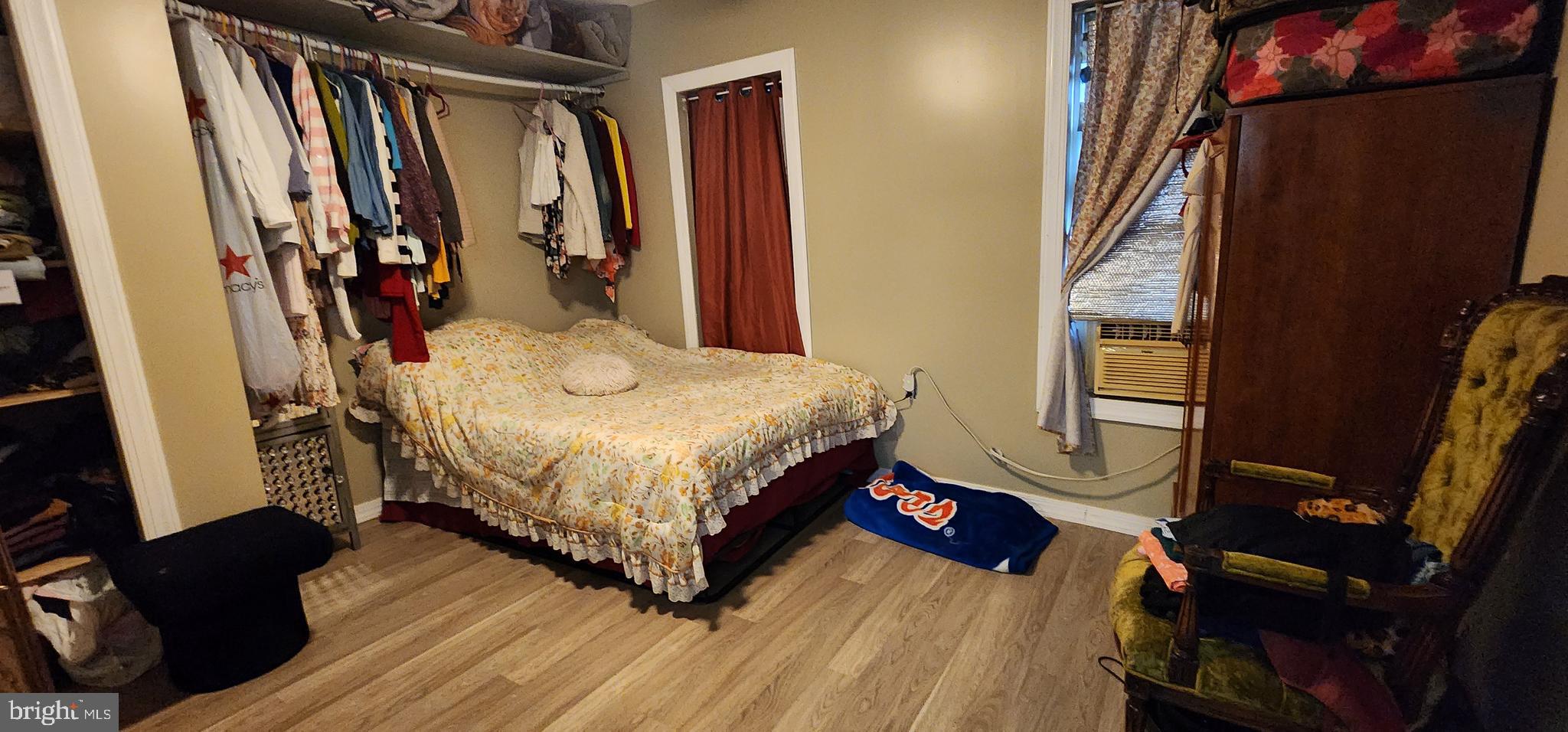 234 Orange Street Reading, PA 19602 - Photo 11 of 18 a bedroom with a bed closet and a mirror