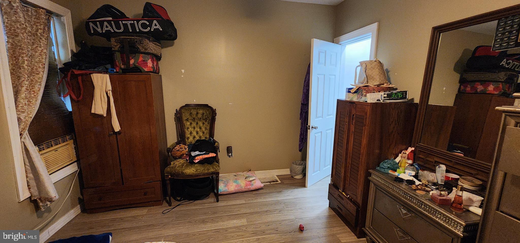 234 Orange Street Reading, PA 19602 - Photo 12 of 18 a bedroom with a bed and a mirror in it