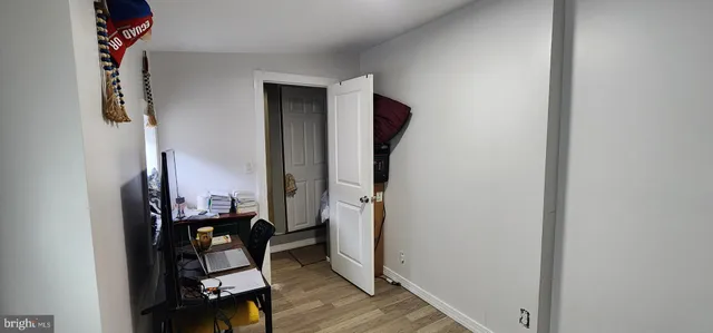 an entryway and livingroom with furniture