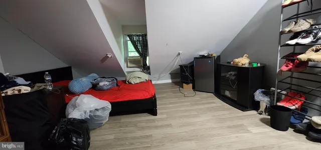 a living room with furniture and stairs