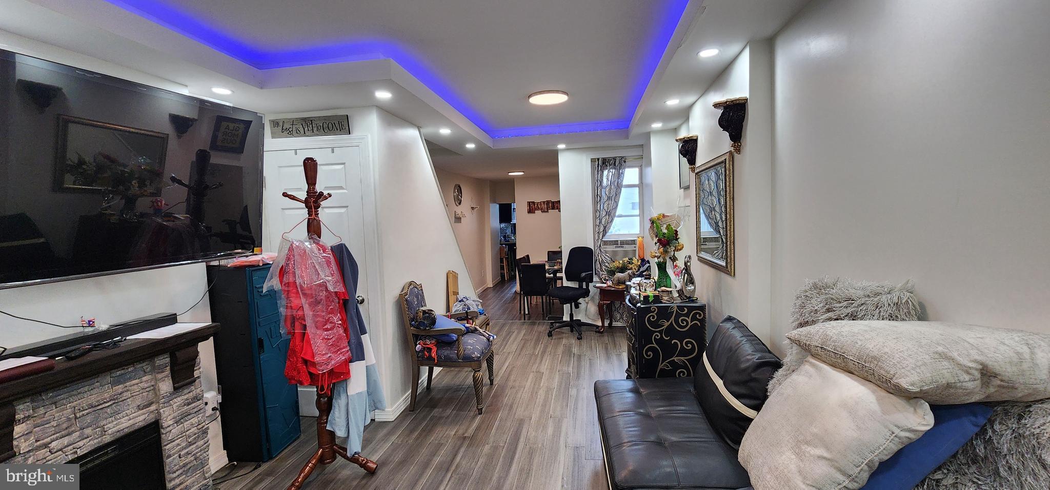 234 Orange Street Reading, PA 19602 - Photo 2 of 18 a living room with furniture and a fireplace