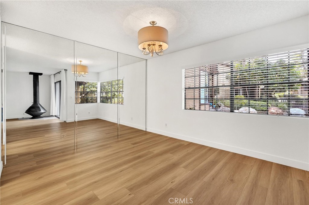 4140 Workman Mill Road, Unit 253 Whittier, CA 90601 - Photo 13 of 63 a view of empty room with wooden floor and fan