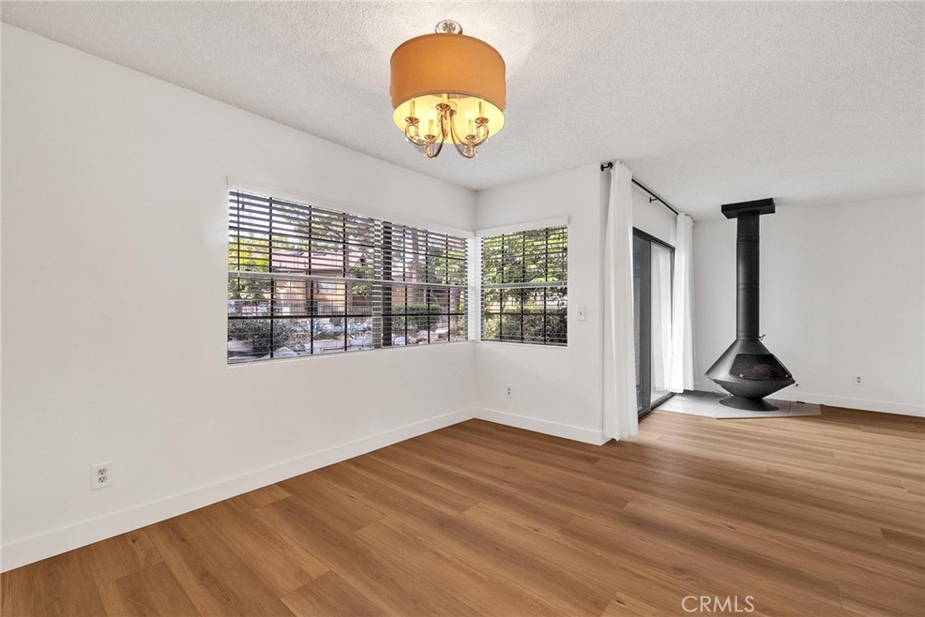 4140 Workman Mill Road, Unit 253 Whittier, CA 90601 - Photo 15 of 63 a view of empty room with wooden floor and fan