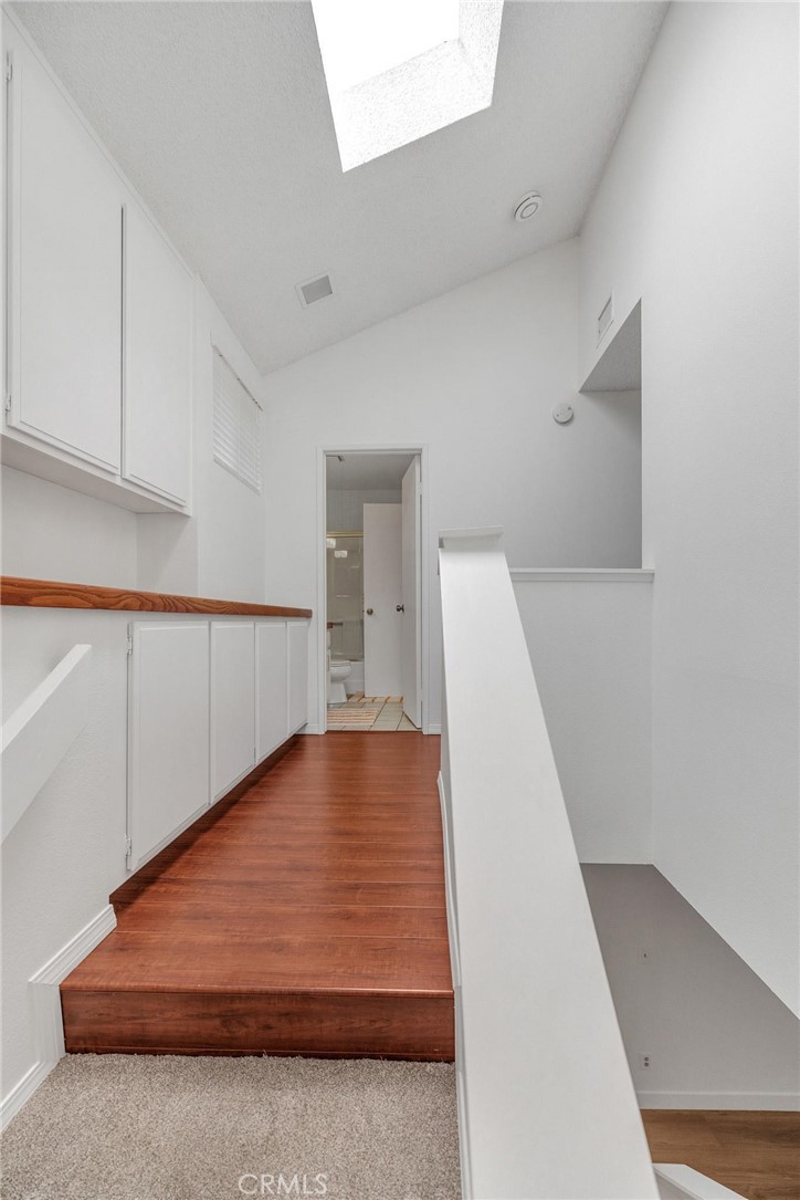 4140 Workman Mill Road, Unit 253 Whittier, CA 90601 - Photo 18 of 63 a view of a room with wooden floor and stairs