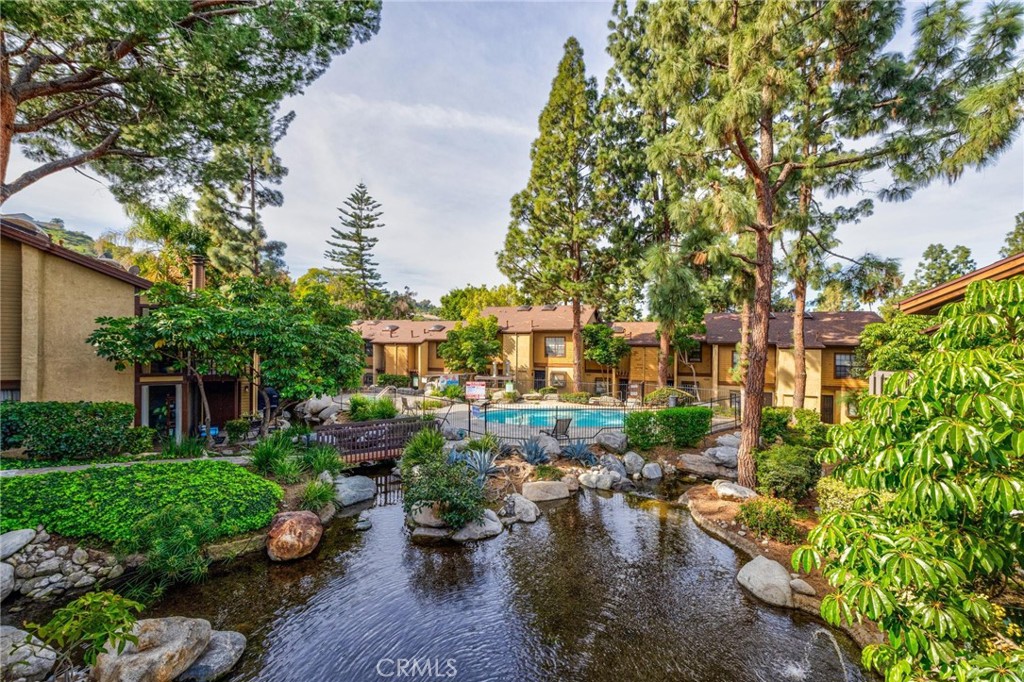 4140 Workman Mill Road, Unit 253 Whittier, CA 90601 - Photo 2 of 63 a view of a lake with a yard and outdoor seating