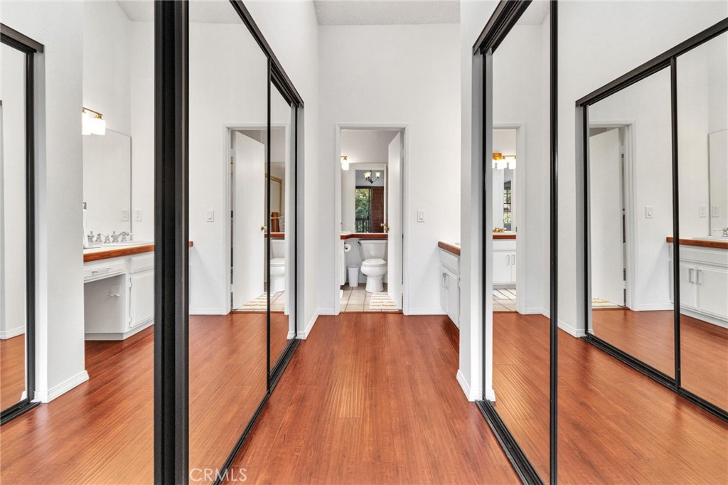 4140 Workman Mill Road, Unit 253 Whittier, CA 90601 - Photo 26 of 63 a view of a hallway with wooden floor and glass door