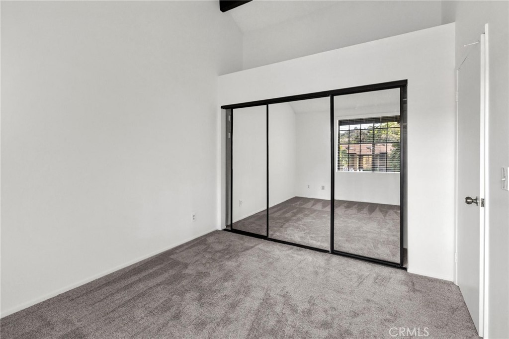 4140 Workman Mill Road, Unit 253 Whittier, CA 90601 - Photo 30 of 63 an empty room with sliding glass door