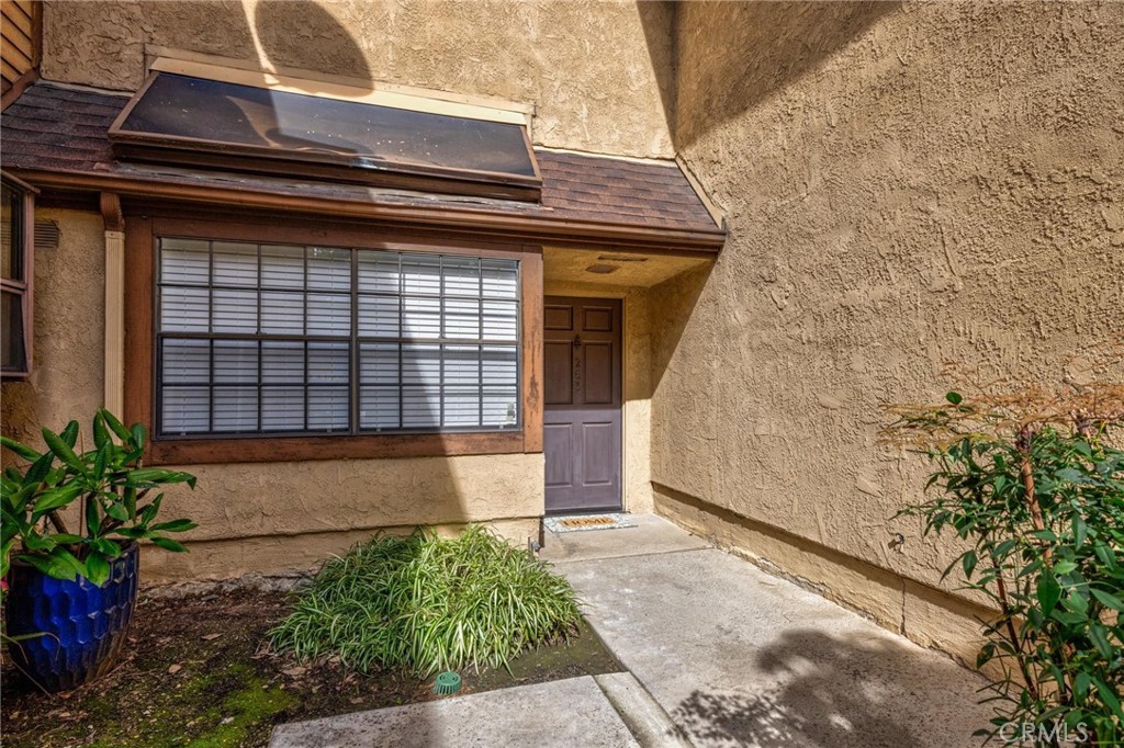 4140 Workman Mill Road, Unit 253 Whittier, CA 90601 - Photo 44 of 63 a front view of a house with a garden