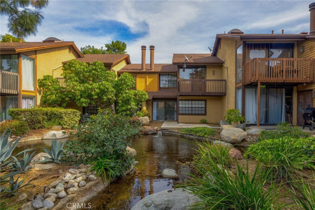 4140 Workman Mill Road, Unit 253 Whittier, CA 90601 - Photo 49 of 63 a front view of a house with garden