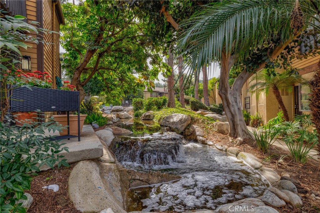 4140 Workman Mill Road, Unit 253 Whittier, CA 90601 - Photo 50 of 63 a view of a backyard with plants and outdoor seating