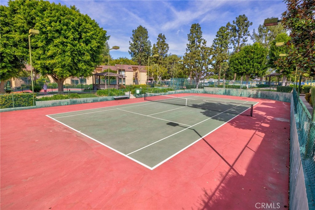 4140 Workman Mill Road, Unit 253 Whittier, CA 90601 - Photo 60 of 63 a view of a tennis ground with large trees