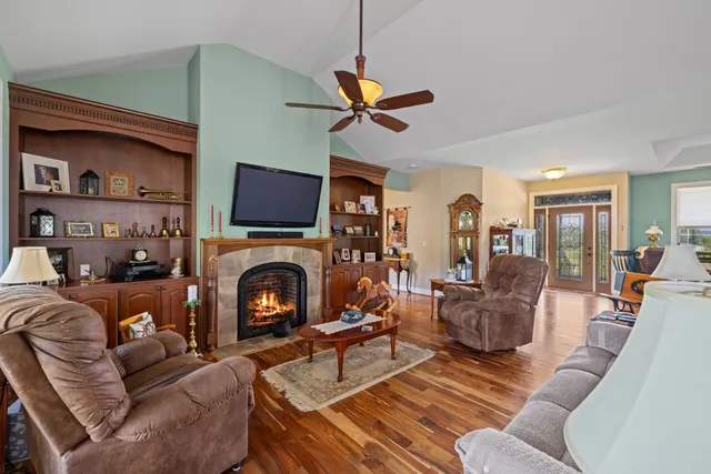 a kitchen with stainless steel appliances granite countertop a sink a stove and a refrigerator
