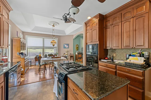 a bedroom with bed and a chandelier