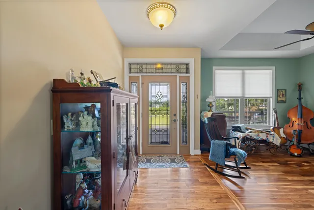 a living room with furniture a fireplace and a book shelf