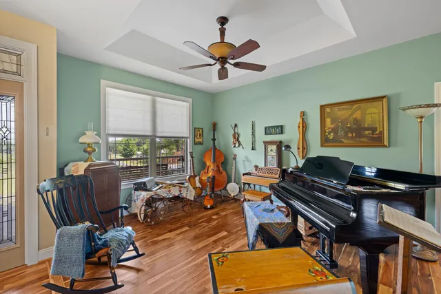 a view of swimming pool with a dining table and chairs