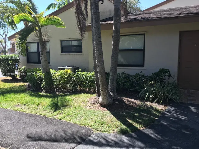 a view of a back yard of the house