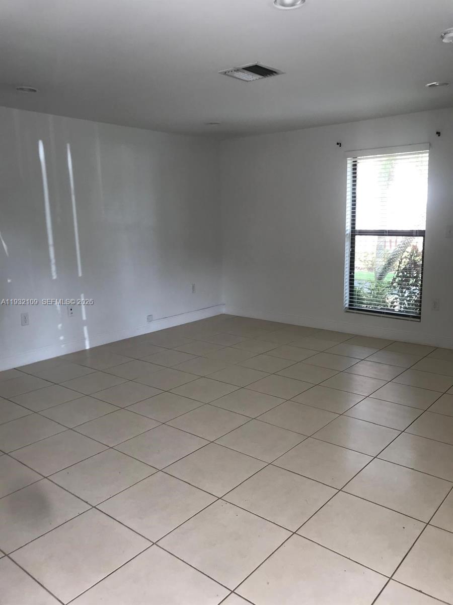 10609 Southwest 113th Place, Unit 87Z Miami, FL 33176 - Photo 8 of 21 an empty room with windows