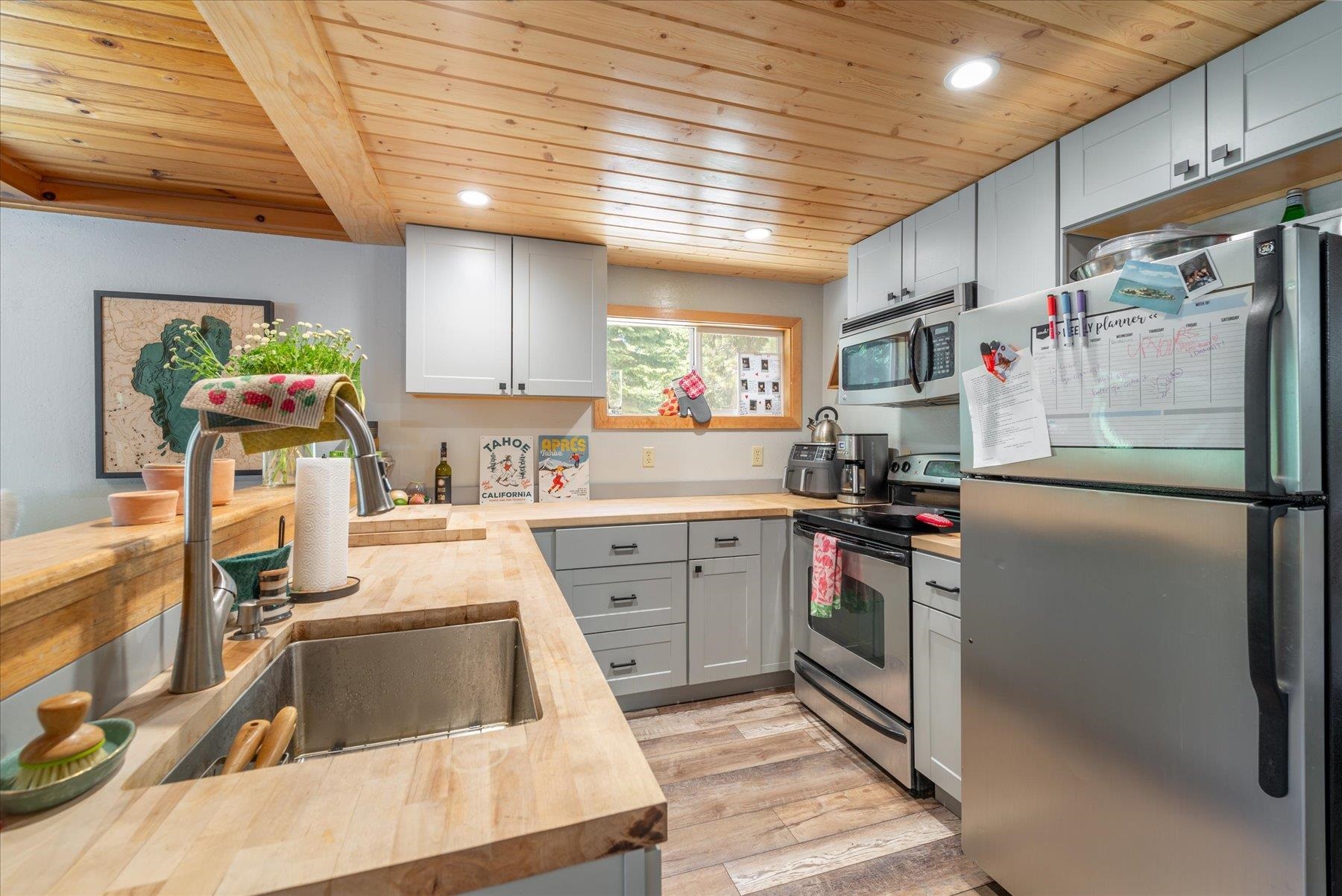 12080 Pine Forest Road Truckee, CA 96161 - Photo 12 of 20 a kitchen with a sink cabinets and appliances