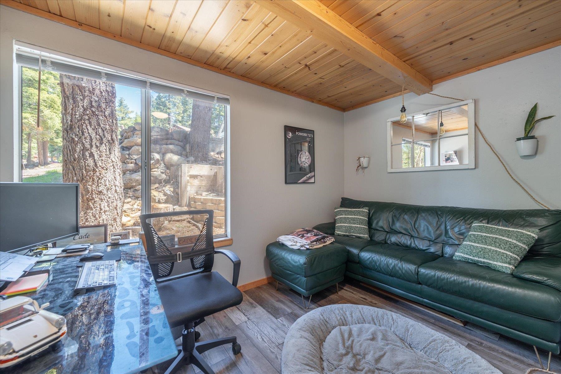 12080 Pine Forest Road Truckee, CA 96161 - Photo 15 of 20 a living room with furniture and a large window