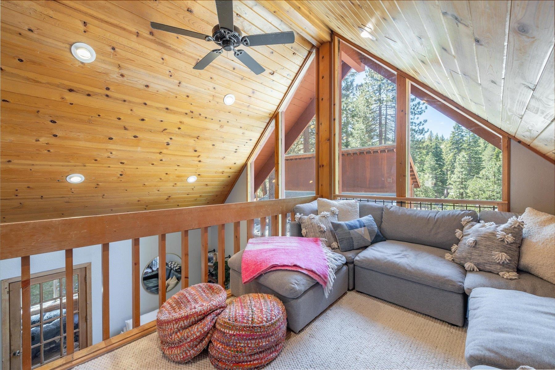 12080 Pine Forest Road Truckee, CA 96161 - Photo 16 of 20 a living room with furniture and a large window