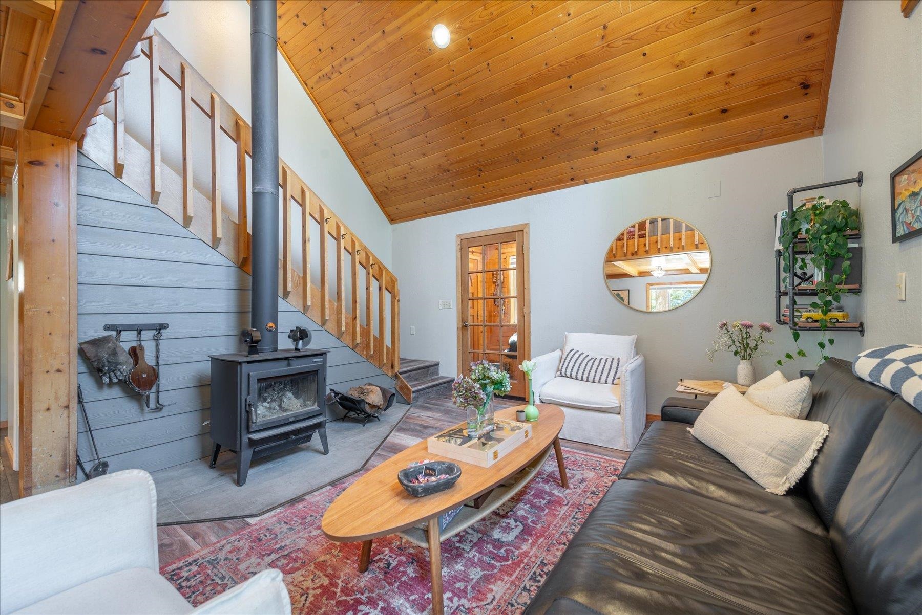 12080 Pine Forest Road Truckee, CA 96161 - Photo 10 of 20 a living room with furniture and a clock