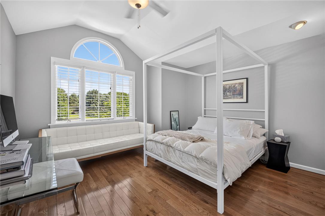 6467 Abbey Road Wind Gap, PA 18091 - Photo 35 of 46 Hardwood floors and a vaulted ceiling elevate this sun-drenched bedroom.