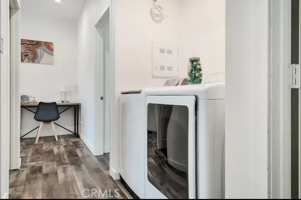 a view of livingroom with furniture and wooden floor