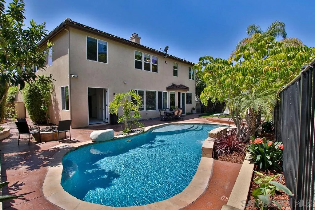 16237 Cayenne Ridge Road San Diego, CA 92127 - Photo 22 of 34 a view of a house with backyard sitting area and swimming pool