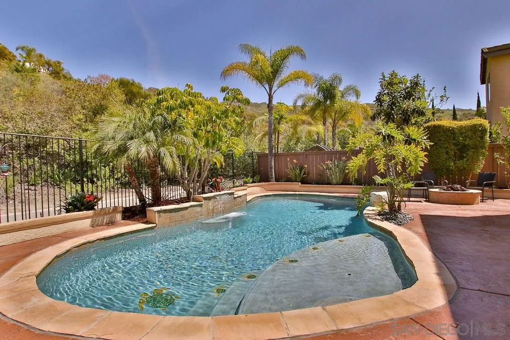 16237 Cayenne Ridge Road San Diego, CA 92127 - Photo 27 of 34 a view of a swimming pool with a yard