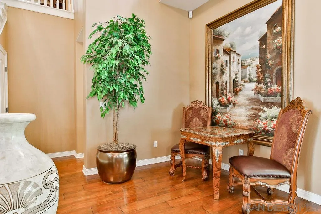 16237 Cayenne Ridge Road San Diego, CA 92127 - Photo 3 of 34 a living room with furniture and a potted plant