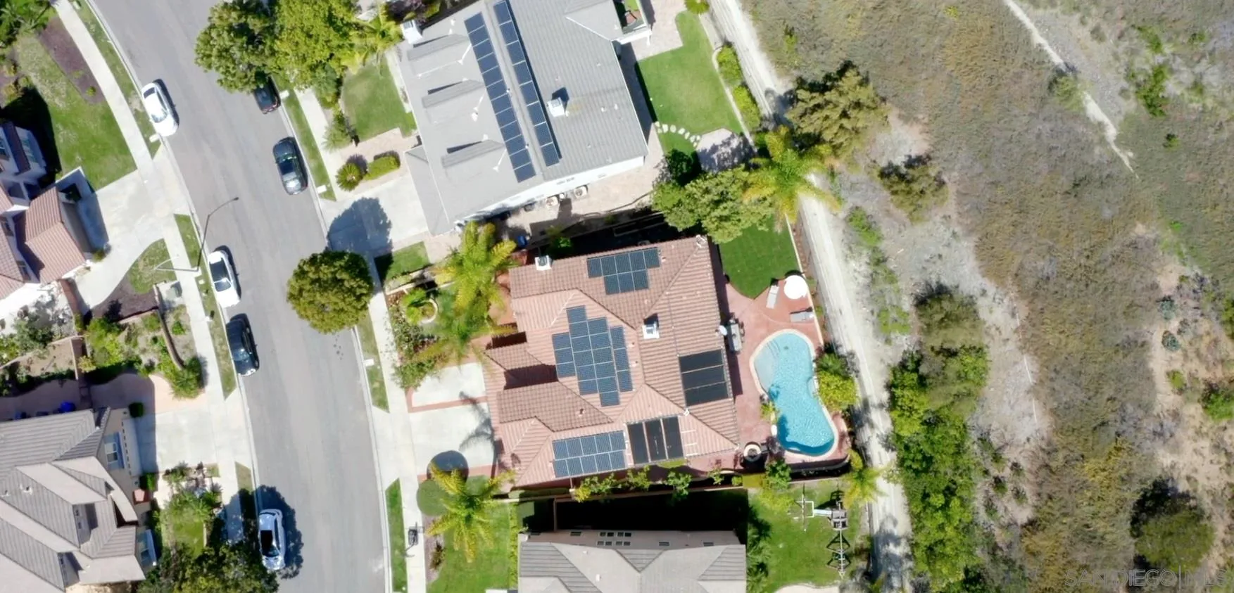 16237 Cayenne Ridge Road San Diego, CA 92127 - Photo 31 of 34 an aerial view of a house with a yard and garden