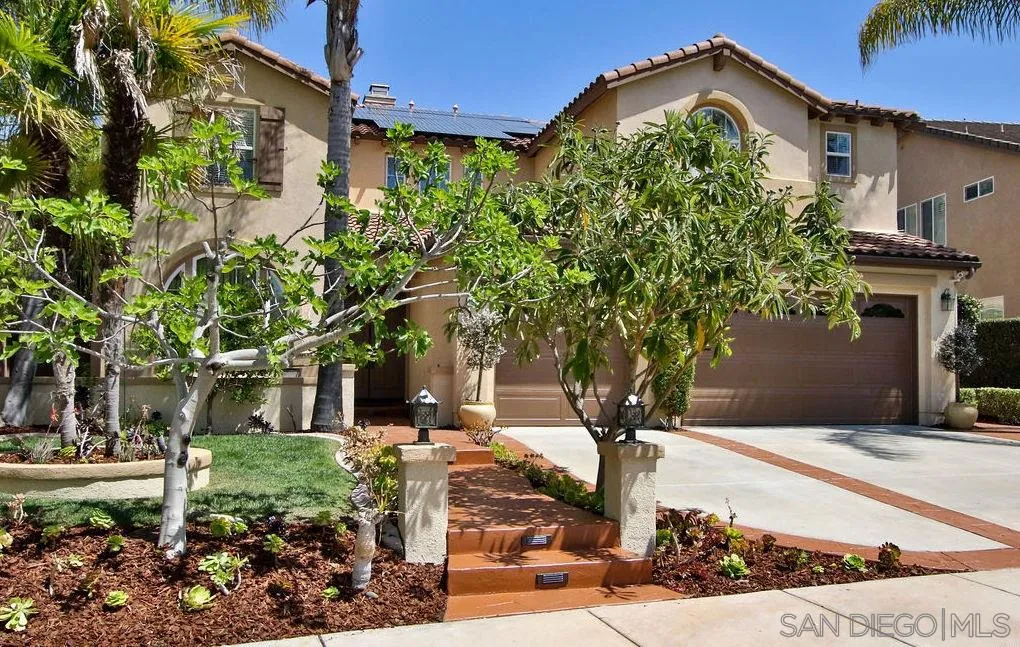 16237 Cayenne Ridge Road San Diego, CA 92127 - Photo 33 of 34 a front view of a house with garden