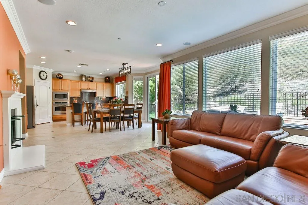 16237 Cayenne Ridge Road San Diego, CA 92127 - Photo 7 of 34 a living room with furniture and large windows