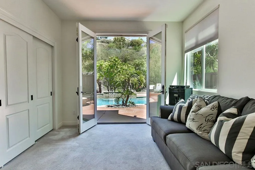 16237 Cayenne Ridge Road San Diego, CA 92127 - Photo 10 of 34 a living room with furniture and a large window