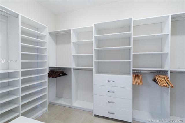a bathroom with a sink a mirror and a bathtub