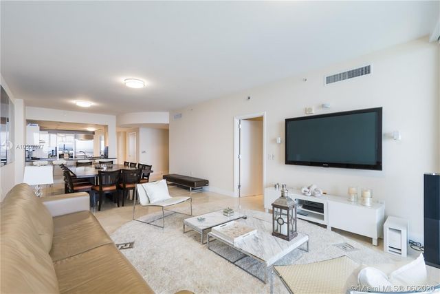 a view of a dining room with furniture and window