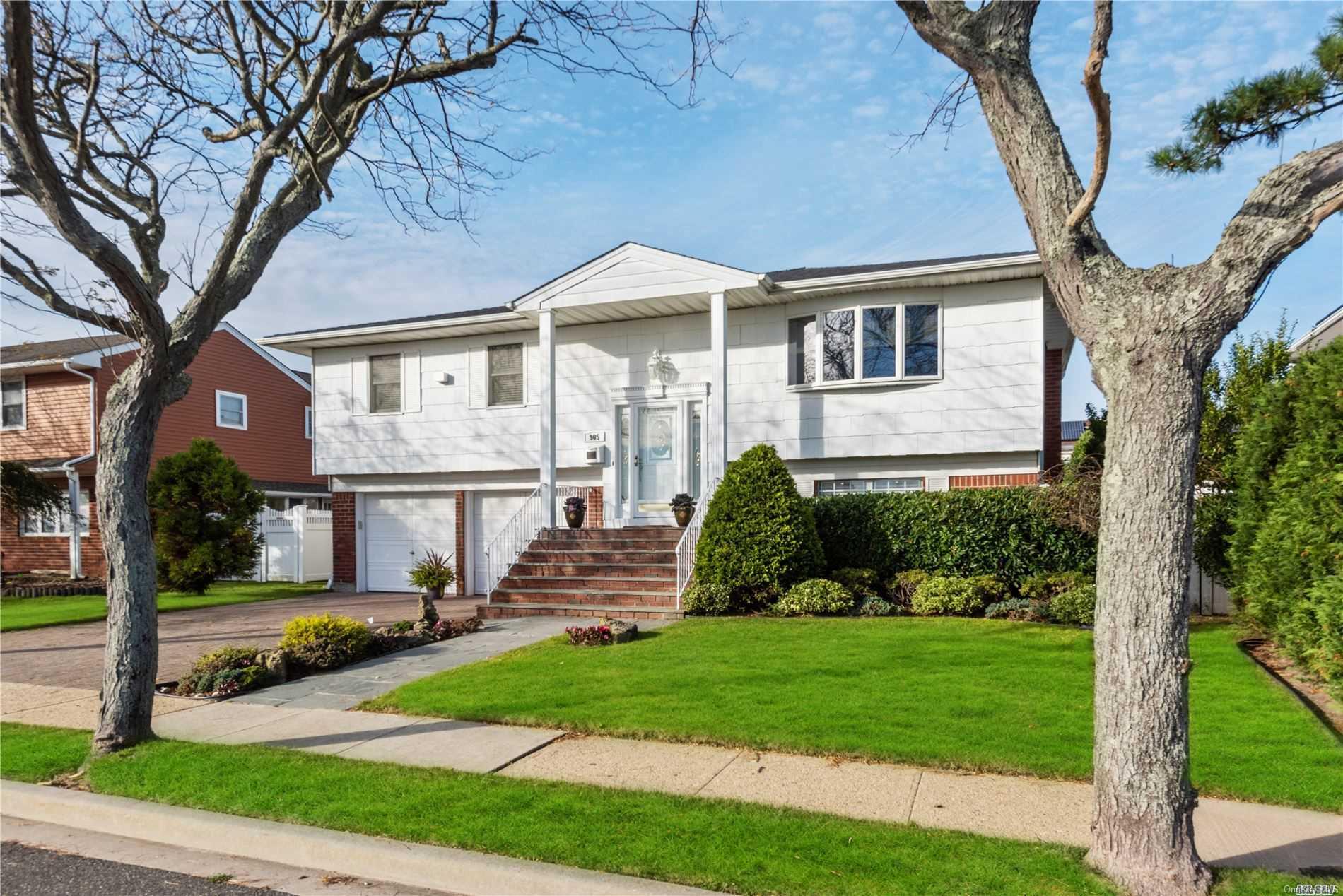 905 Marginal Road Lido Beach, NY 11561 - Photo 1 of 1 a front view of a house with a yard