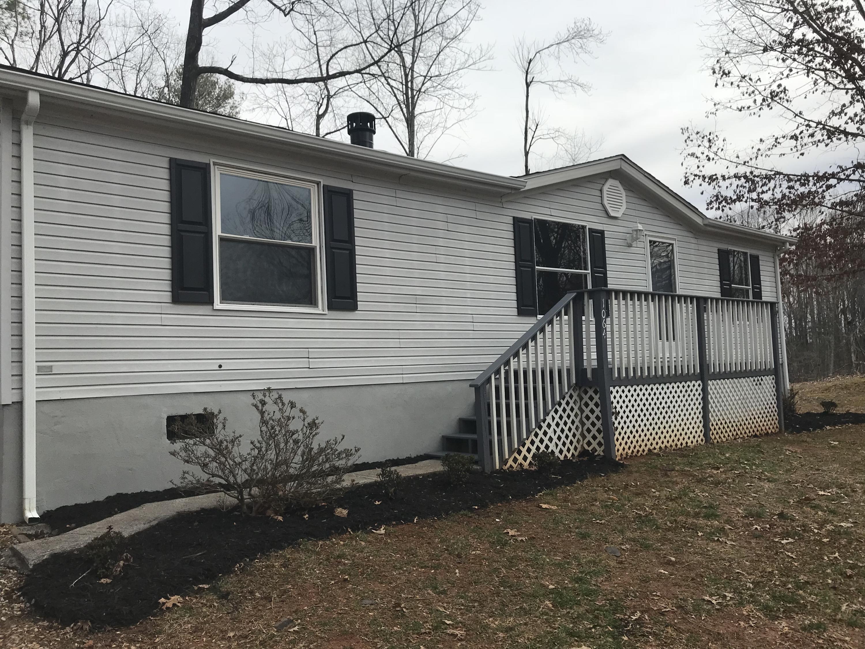 1064 Old Plantation Road Goodview, VA 24095 - Photo 3 of 10 a view of a house with a yard