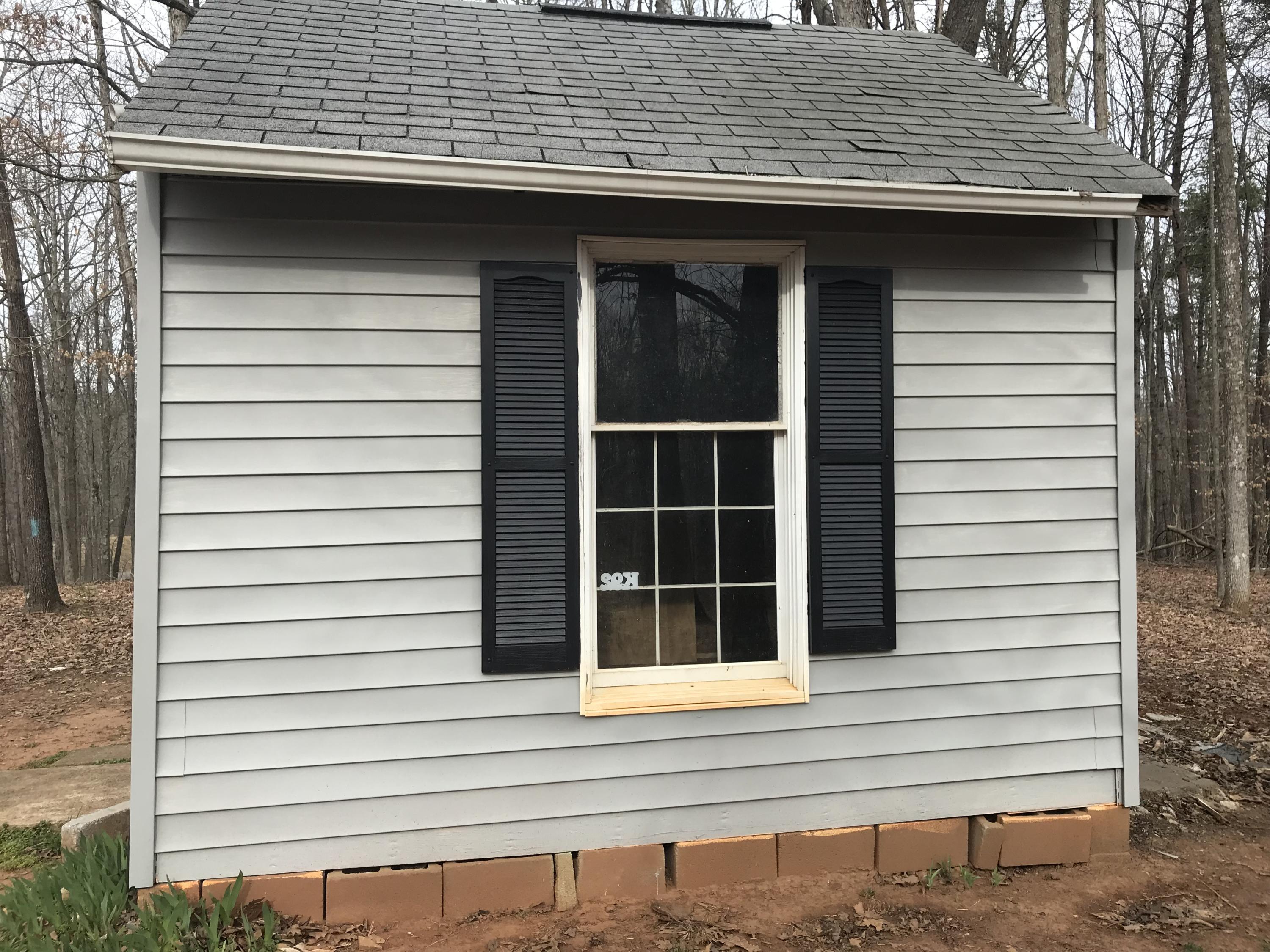 1064 Old Plantation Road Goodview, VA 24095 - Photo 5 of 10 a side view of a house with a large window