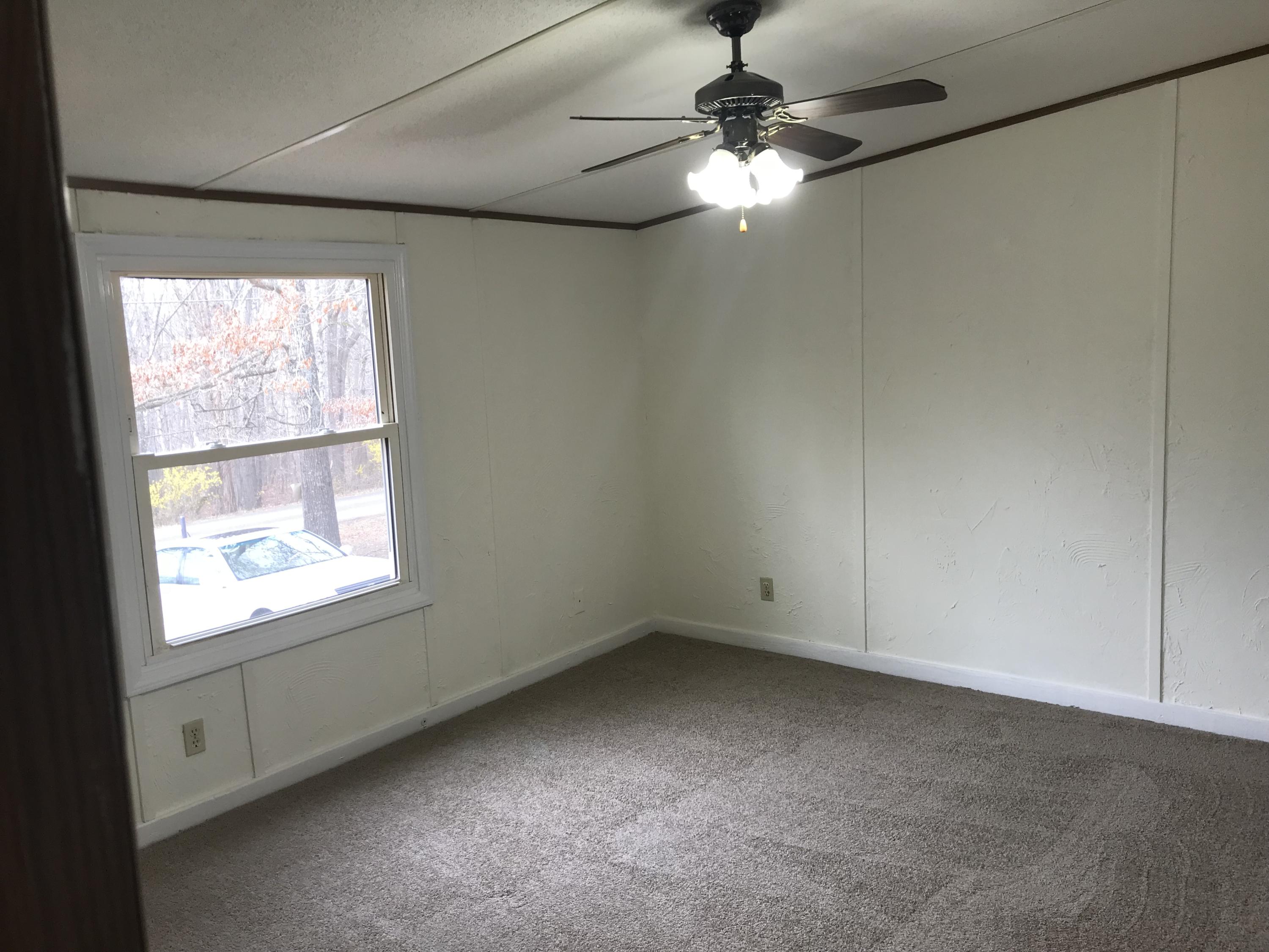 1064 Old Plantation Road Goodview, VA 24095 - Photo 9 of 10 an empty room with a window