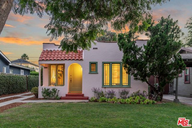 front view of a house with a garden