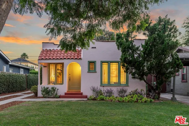 front view of a house with a garden