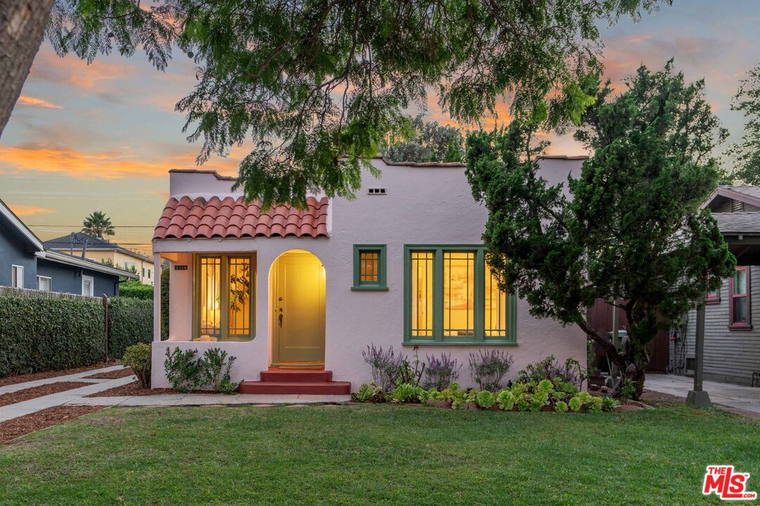 front view of a house with a garden